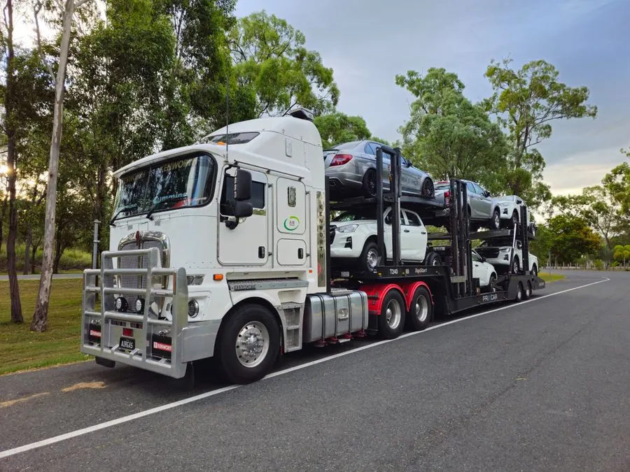 Car carrier truck transporting cars on the highway